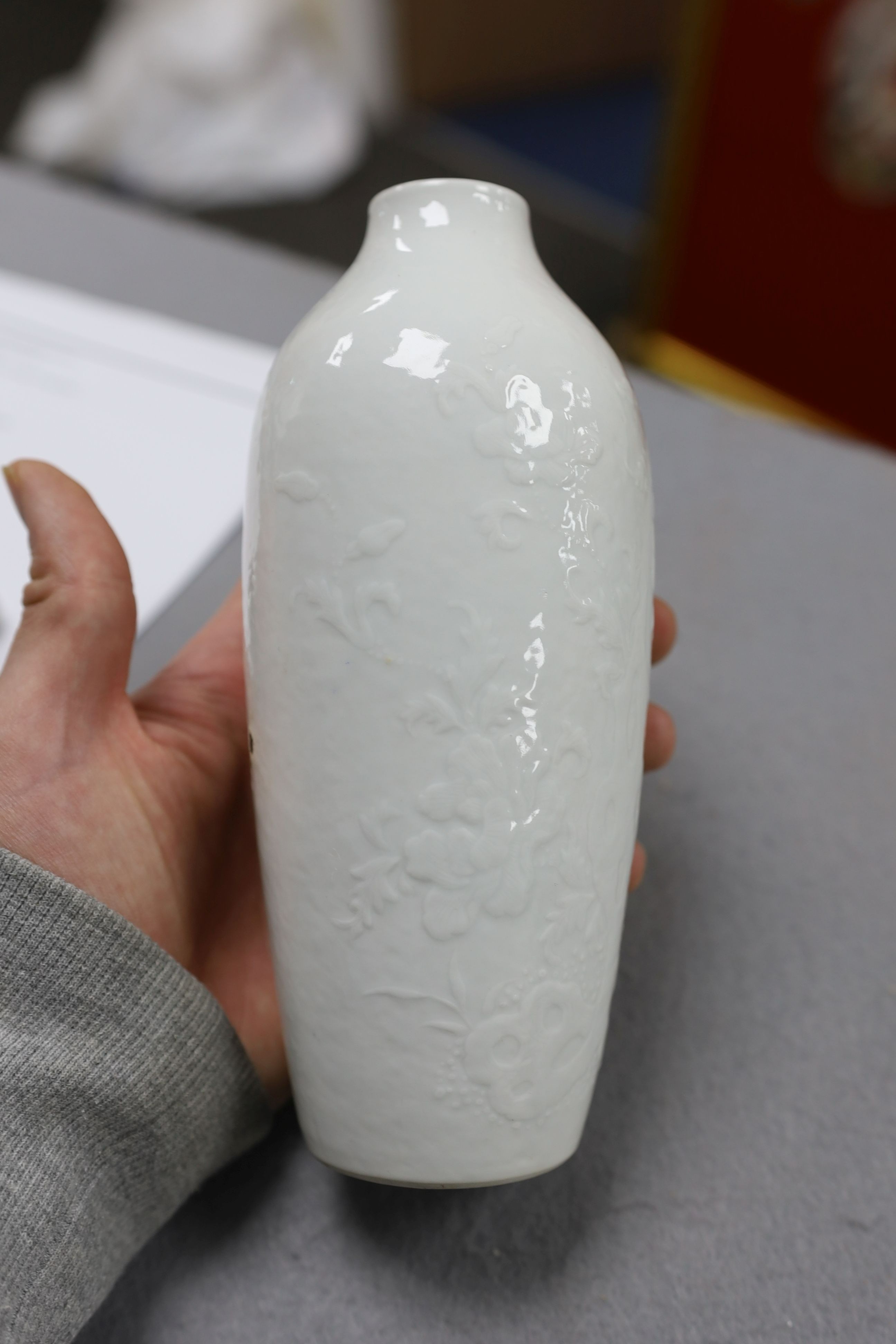 A Chinese moulded white glazed vase, Qianlong period, 18.3cm high, glaze blemish